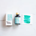 Tom's Studio Barrier Reef Shimmer Fountain Pen Ink – featuring the packaging, bottle and a swatch on paper