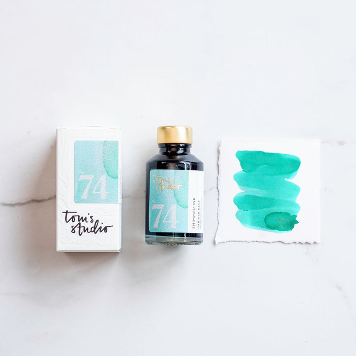 Tom's Studio Barrier Reef Shimmer Fountain Pen Ink – featuring the packaging, bottle and a swatch on paper