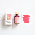 Tom's Studio Watermelon Shimmer Fountain Pen Ink – featuring the packaging, bottle and a swatch on paper
