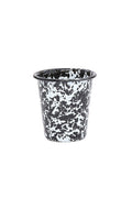 Short enamel cup with black and white splatter texture on white background