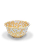 Yellow and white enamelware bowl on a white background
