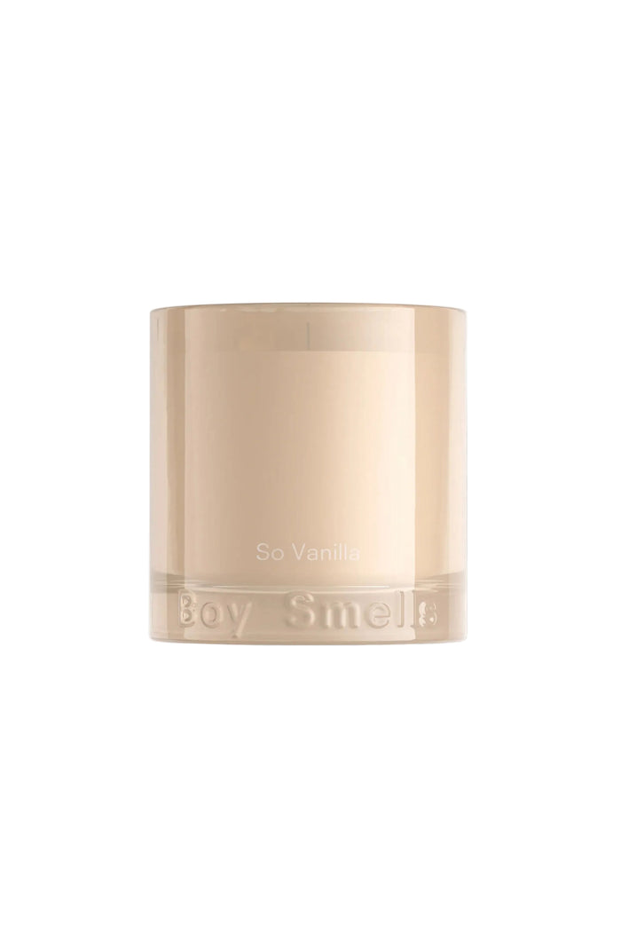 Beige candle with 'Boy Smells' branding on a white background