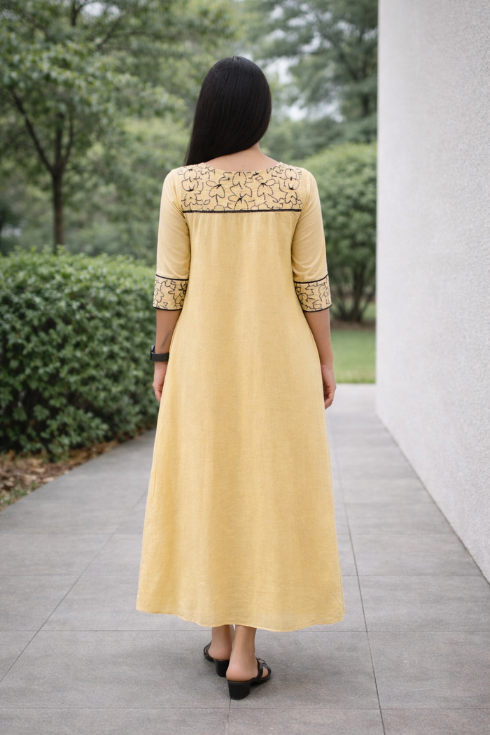 Soft beige shaded viscose mul chanderi A-line kurti with black floral thread embroidered yoke MBS-841