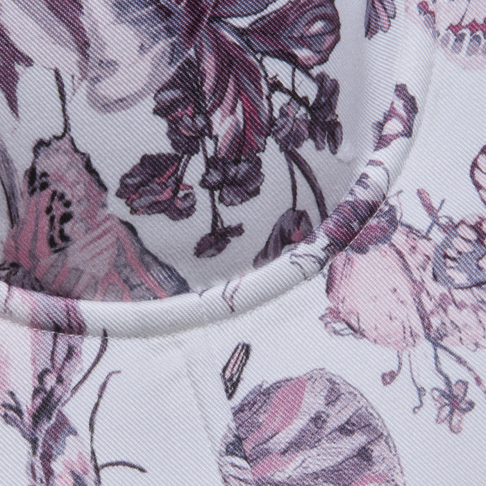Close-up of the Sonya Bustier’s lightweight Tencel fabric in a pink and purple floral pattern, highlighting the detailed stitching along a curved seam.