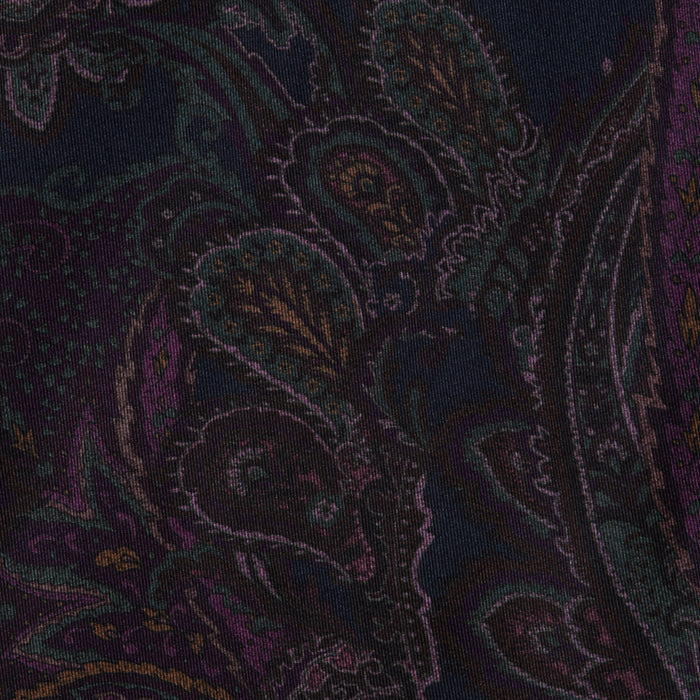 The Sonya Bustier features a dark navy paisley fabric with intricate, swirling patterns in shades of purple, green, and gold on a black background, creating an ornate and textured appearance.