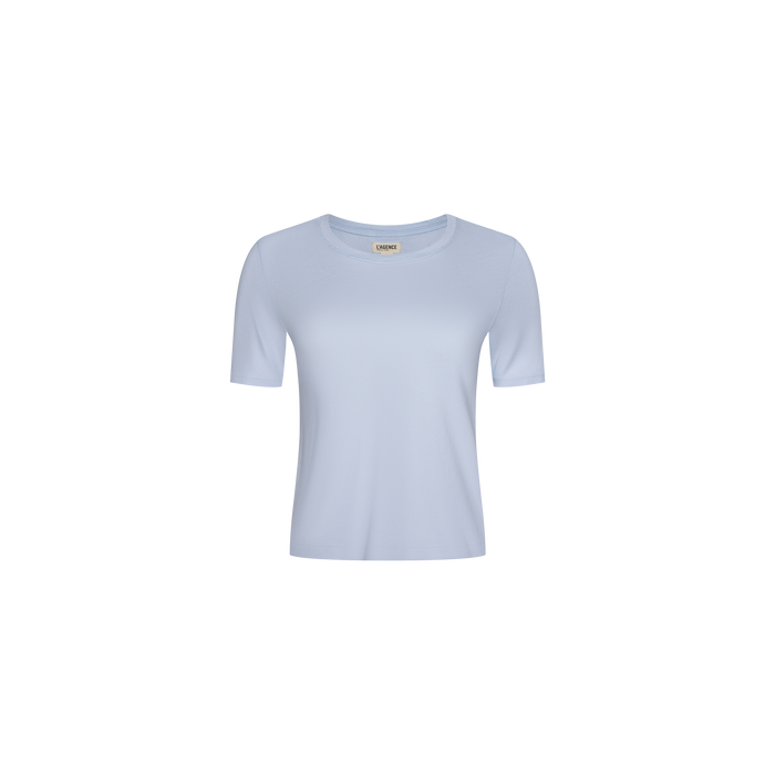 The Stormy Cropped Cotton Tee, a semi-relaxed organic cotton shirt in light blue with a cropped length, is centered on a white background and displayed from the front.