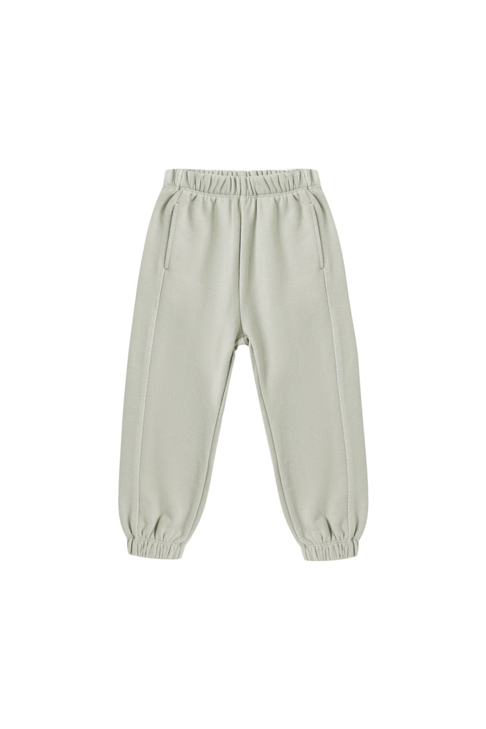 A pair of light sage green jogger pants with an elastic waistband and elastic cuffs, shown flat on a white background.