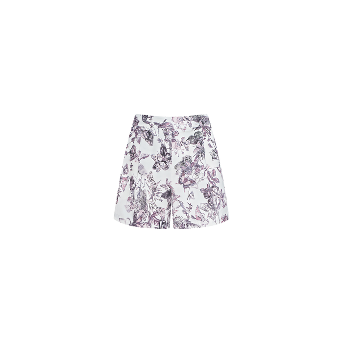 The Sylie Short is a pair of white high-waisted pull-on shorts with a purple and black floral print, featuring an elasticized waistband, displayed on a plain white background.