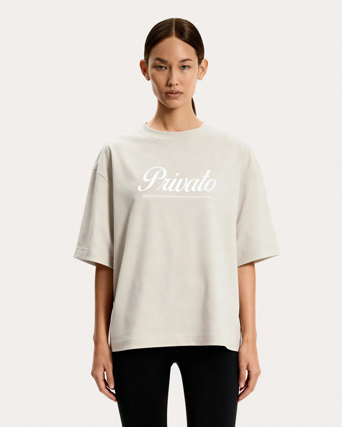 T-shirt beige con logo e maniche scese