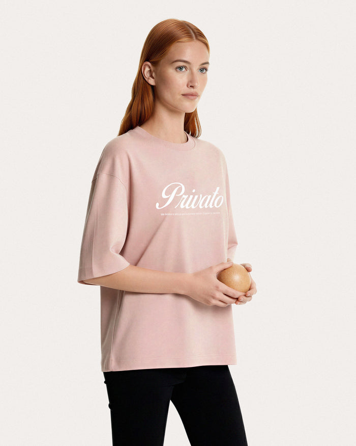 T-shirt rosa con logo e maniche scese