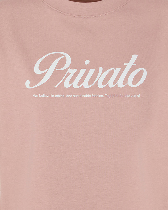 T-shirt rosa con logo e maniche scese