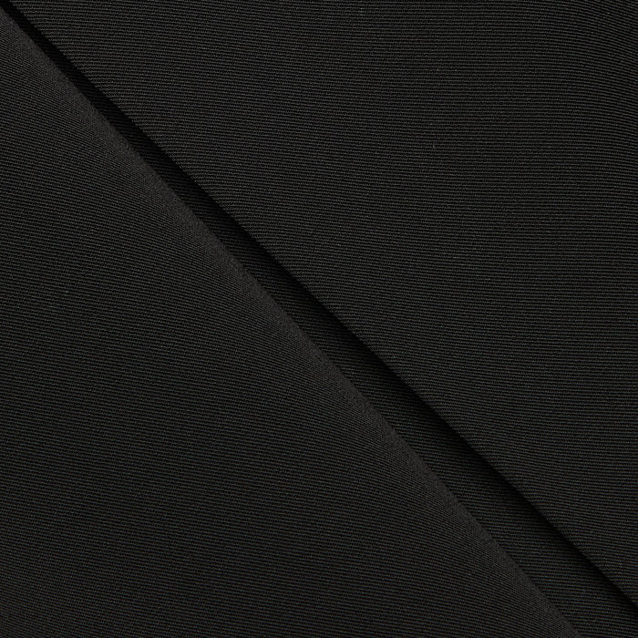 Close-up of black fabric with a diagonal fold, showing fine texture and subtle weave pattern—ideal for the Tania Pleated Mini Skirt.