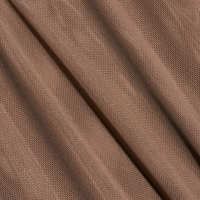 Close-up of the Thalassa High-Leg Bodysuit, featuring light brown mesh fabric with a fine, net-like texture and diagonal folds that create shadowed lines across the surface, evoking chic French style.