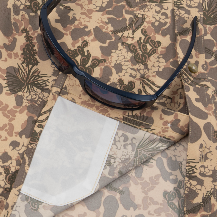 Closeup of sunglasses with lens cleaner on shirt