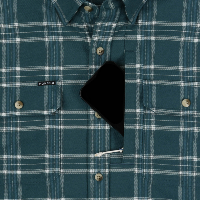 Close-up of The Codfather plaid shirt with hidden chest pocket holding a smartphone.
