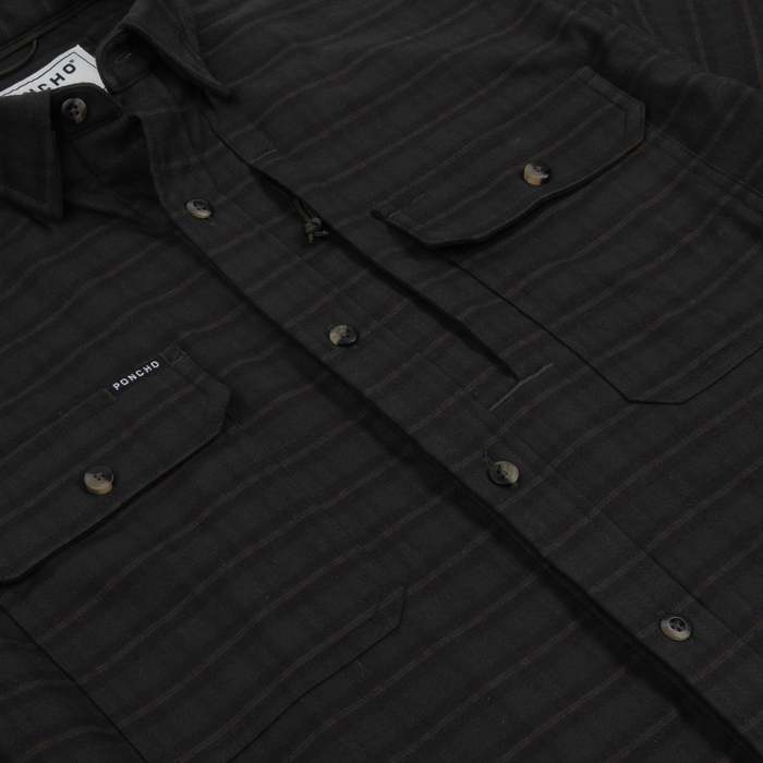 Close-up of a dark striped shirt with buttoned chest pockets and a subtle plaid pattern called The Gloucester.
