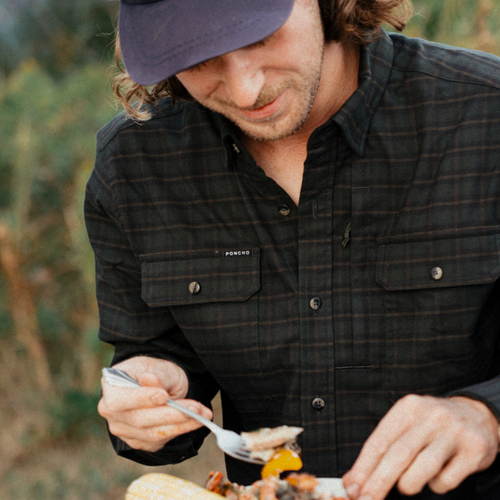 The Gloucester dark plaid shirt worn outdoors while enjoying a meal