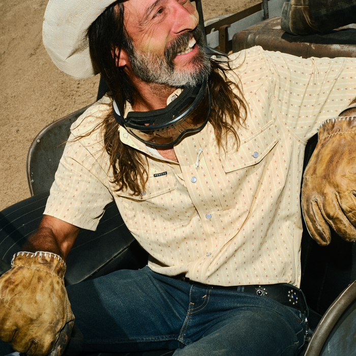 man in dune buggy wearing the liberty bell shirt