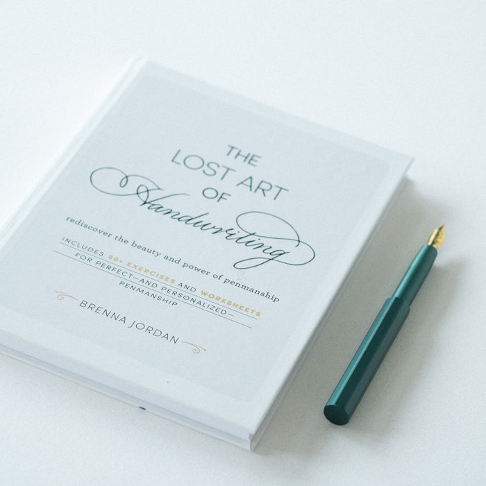 The Lost Art of Handwriting by Brenna Jordan - book pictured with the Pocket Fountain Pen in Ivy.