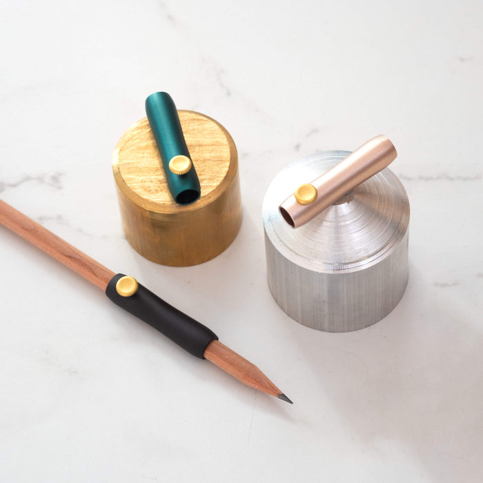 The Poise Pencil Grip Extender in (left to right) Black, Ivy and Blush.