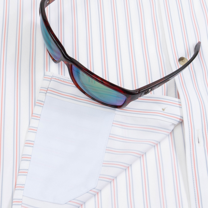 Closeup of sunglasses with lens cleaner on shirt
