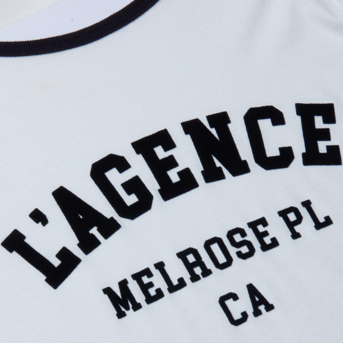Tommie Crewneck Tee featuring black collegiate-style text that reads “LAGENCE MELROSE PL CA” on a white background. Crafted from soft Supima cotton, this relaxed-fit ringer tee delivers both comfort and style.