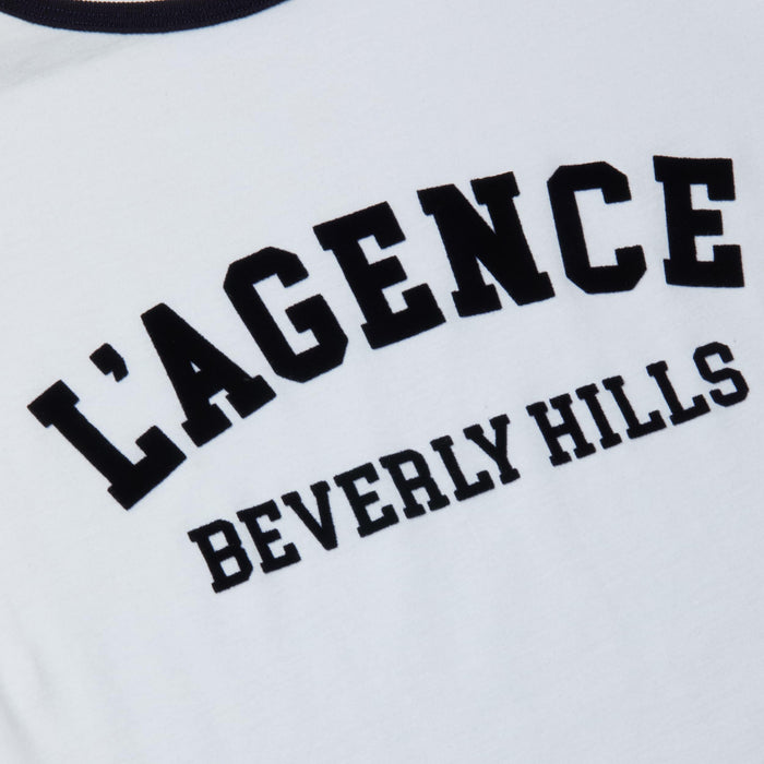 The Tommie Crewneck Tee is a relaxed-fit white shirt made from Supima cotton, featuring bold black “LAGENCE” lettering above smaller “Beverly Hills” text.