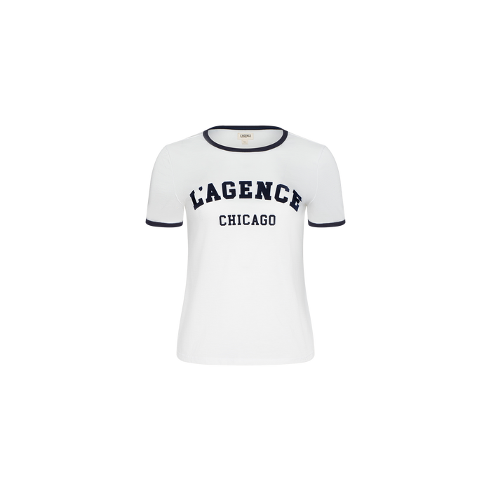 White short-sleeve Tommie Crewneck Tee featuring dark trim on the collar and sleeves. Crafted from soft Supima cotton in a relaxed fit, this shirt displays “LAGENCE CHICAGO” printed in bold, dark letters across the plain white chest.
