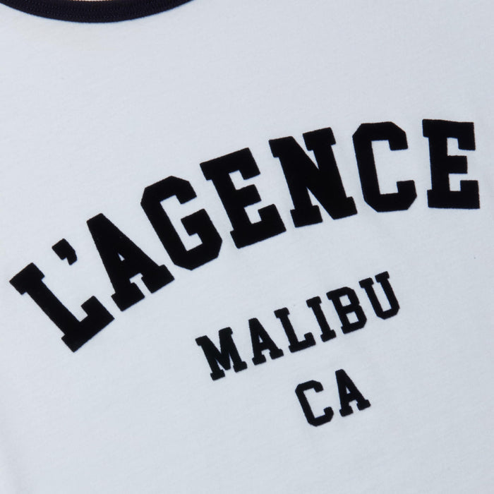 Tommie Crewneck Tee: A white ringer tee featuring bold, collegiate-style black text that reads “LAGENCE MALIBU CA,” crafted from soft Supima cotton and detailed with the signature L’AGENCE logo.