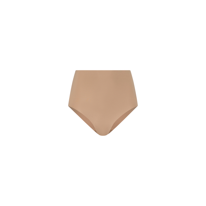 Elevate your essentials with the Velle Knit Panty, featuring a seamless design and nude color for a discreet look under any outfit. This L’AGENCE undergarment offers gentle compression for a smooth, comfortable fit.