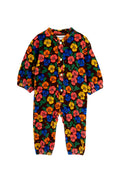 A long-sleeve baby jumpsuit with a vibrant multicolor floral print on a dark brown background. The print features red, orange, yellow, and blue flowers with green leaves.