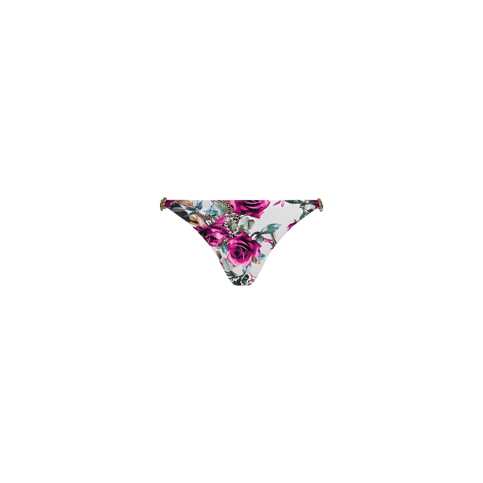 The Violet String Bikini Bottom features pink and purple rose prints with green leaves on a white background, and is designed with thin side straps accented by subtle chain hardware.